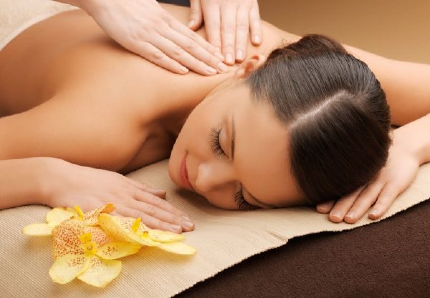 woman in spa salon lying on the massage desk picture of woman in spa salon lying on the massage desk